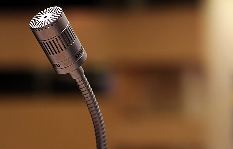 A microphone represents that the call for papers is opened
