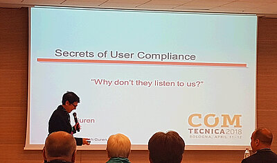 Leah Guren holding a presentation on Secrets of User Compliance