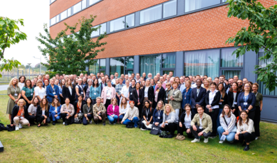 group photo of participants of the NORDIC TechKomm Copenhagen in front of a building