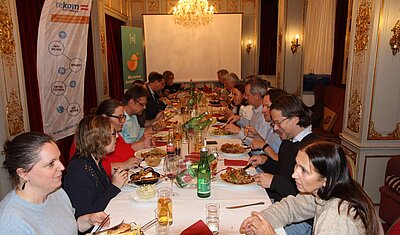 tekom Austria members eating at a long dinner table