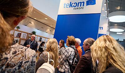 tekom Europe conference booth with people